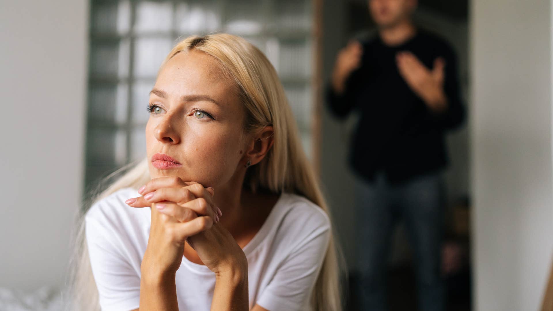woman avoiding eye contact ignoring man