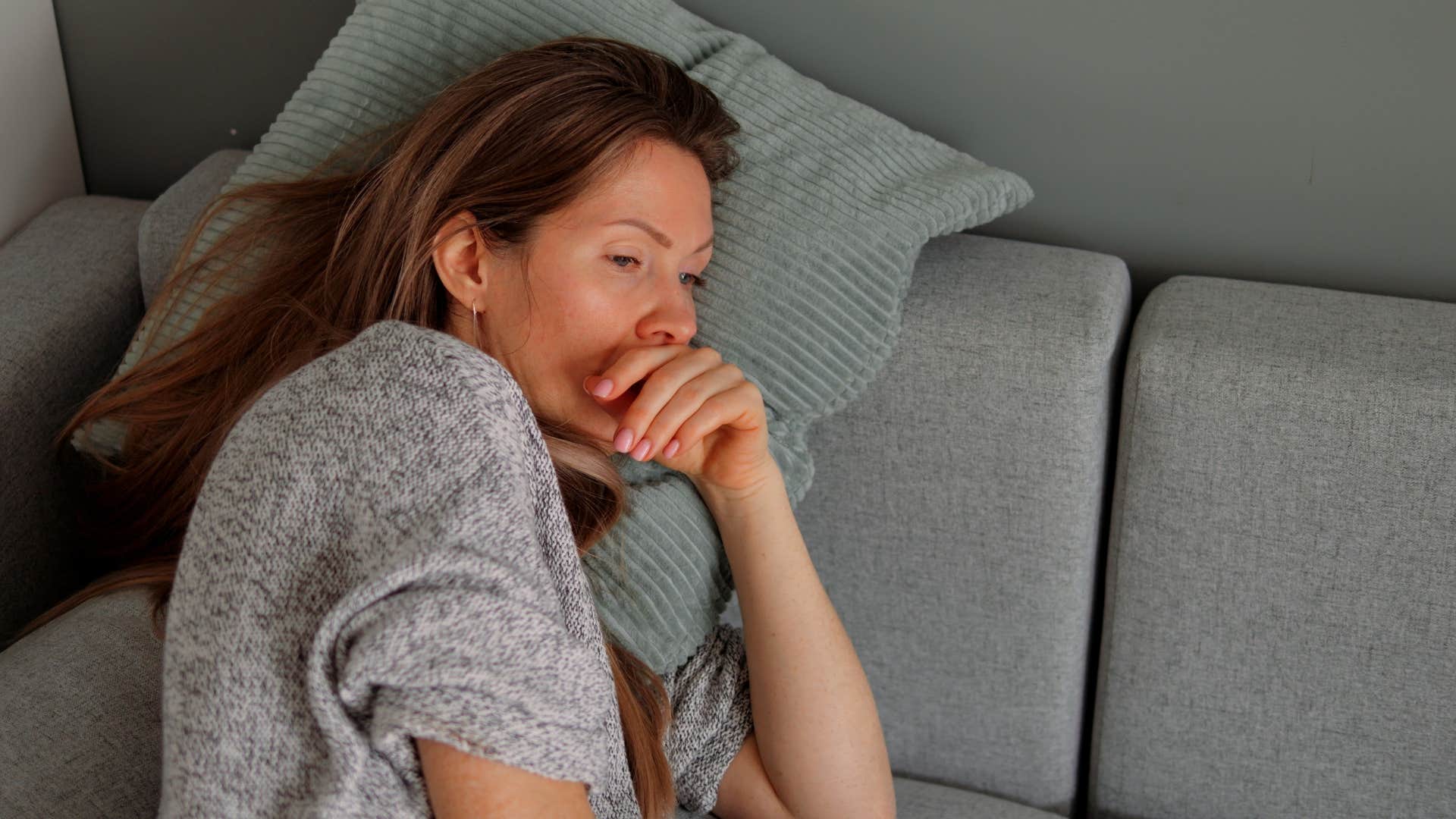 emotionally burned out woman laying in bed