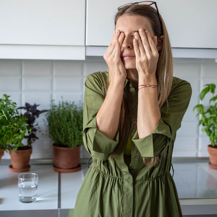 stressed woman waking up to a cluttered home