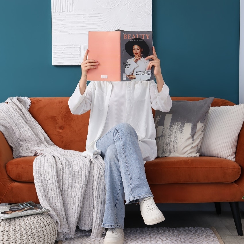 Woman absorbed in a beauty magazine