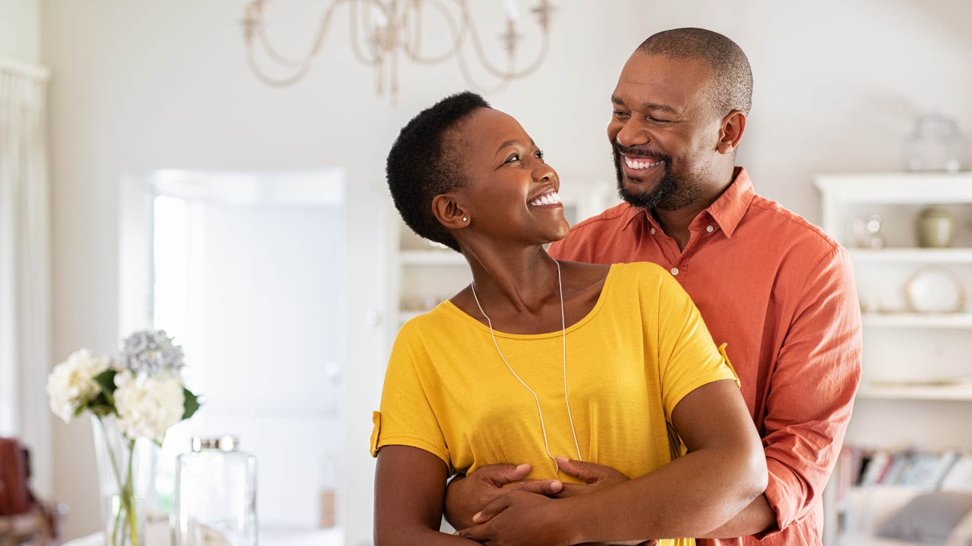 woman looking at her husband remembering why she fell for him
