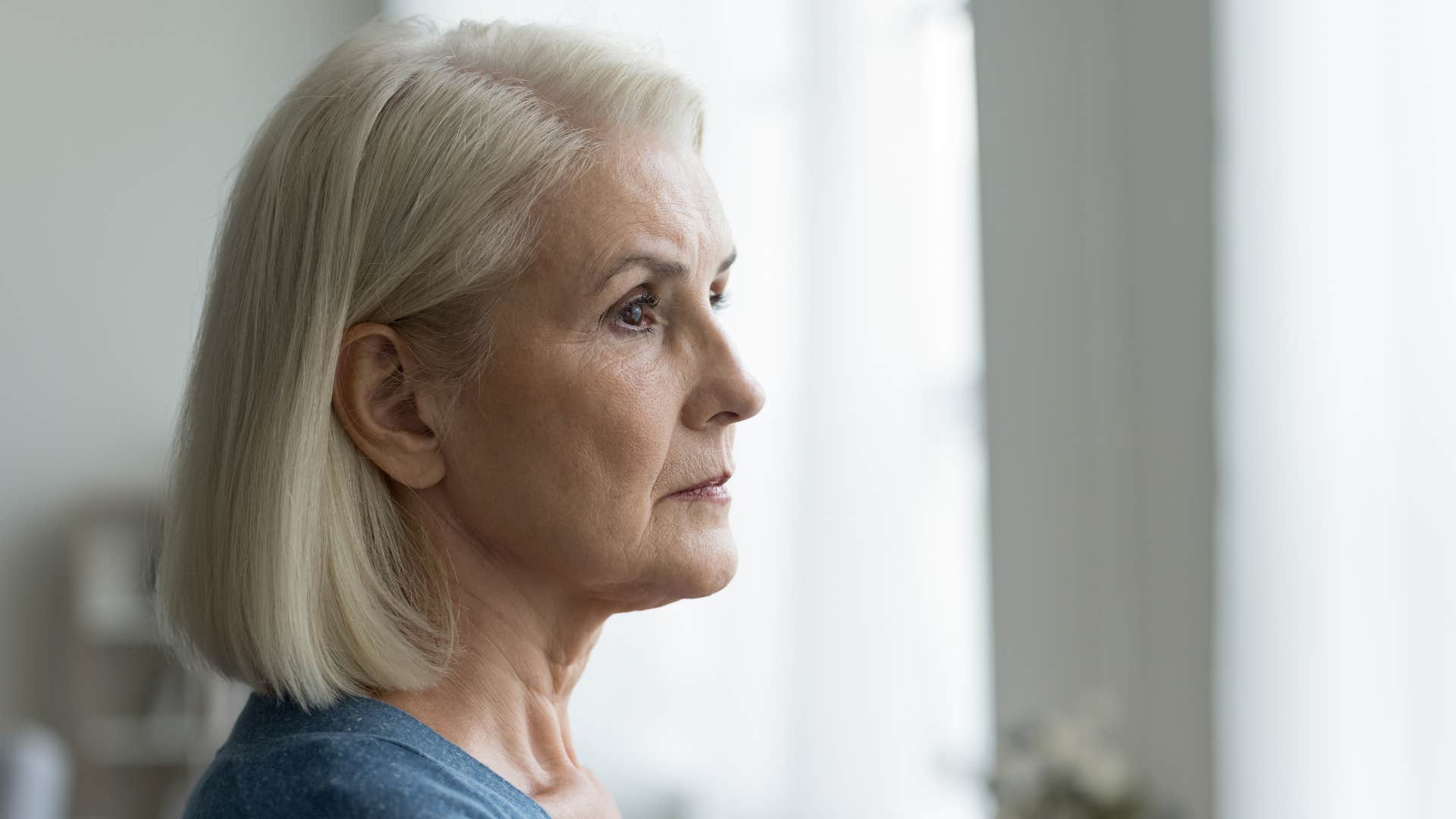 older woman reminiscing about her past