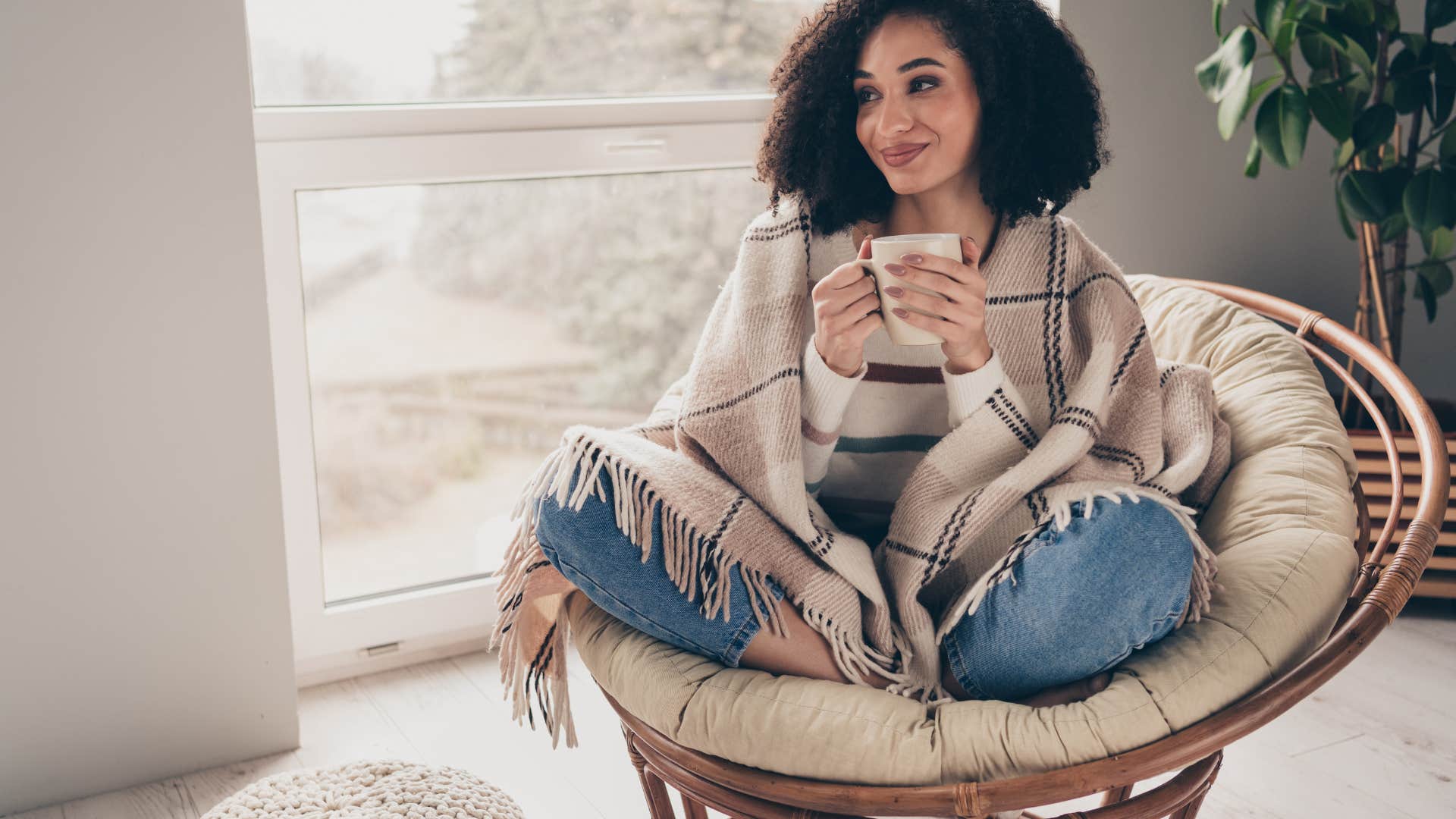 happy woman drinking coffee knowing her self-worth