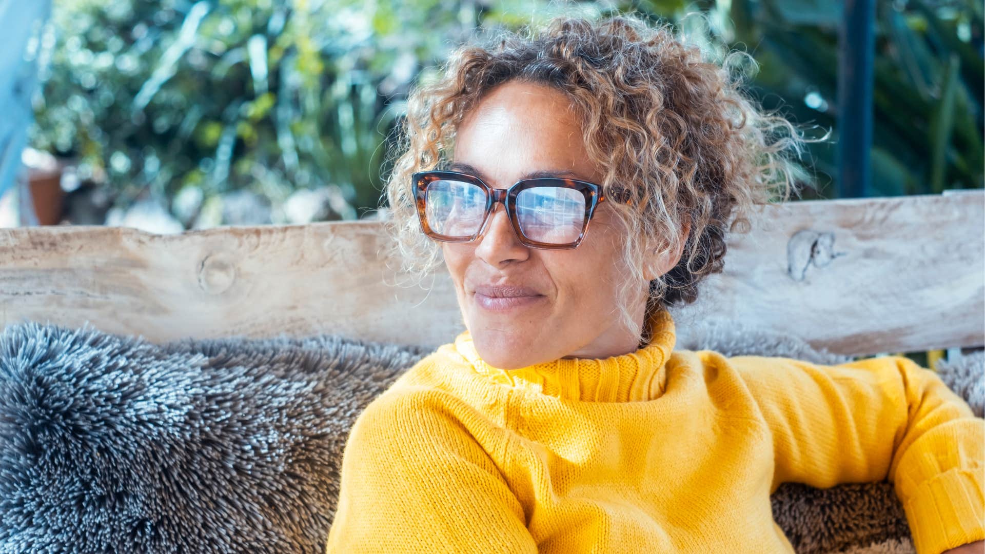 woman protecting her peace at home smiling