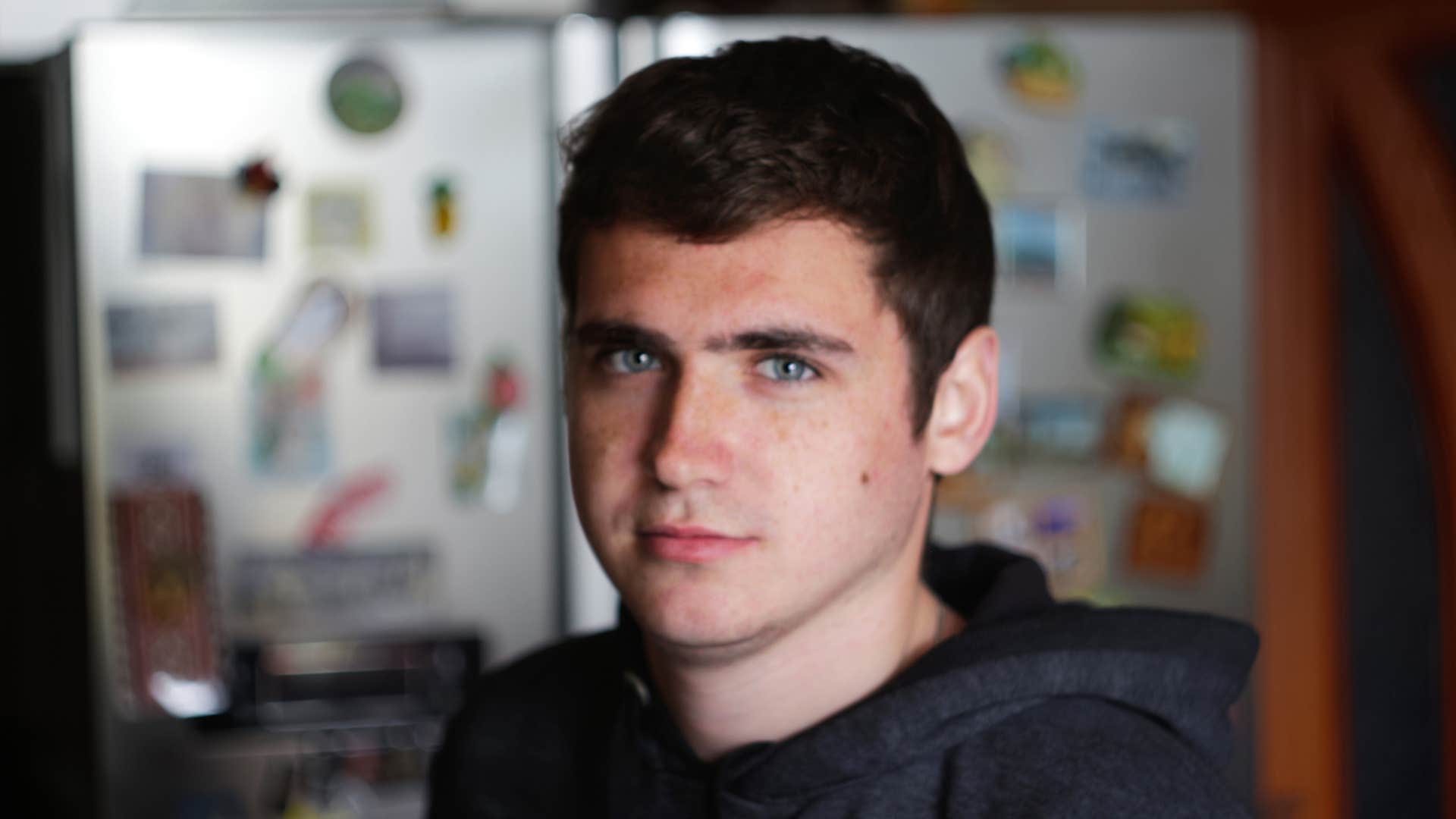 young serious man struggling with emotional vulnerability