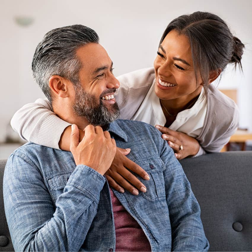 trusting couple looking at each other smiling