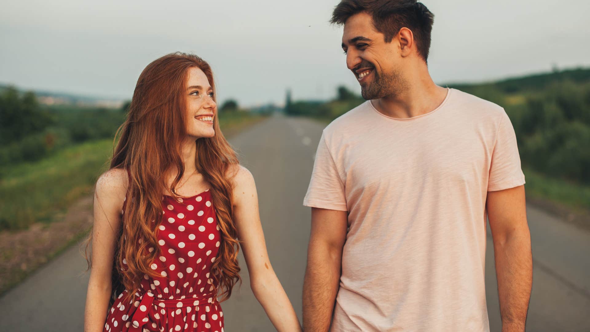man holding wife's hand seeing her as an equal