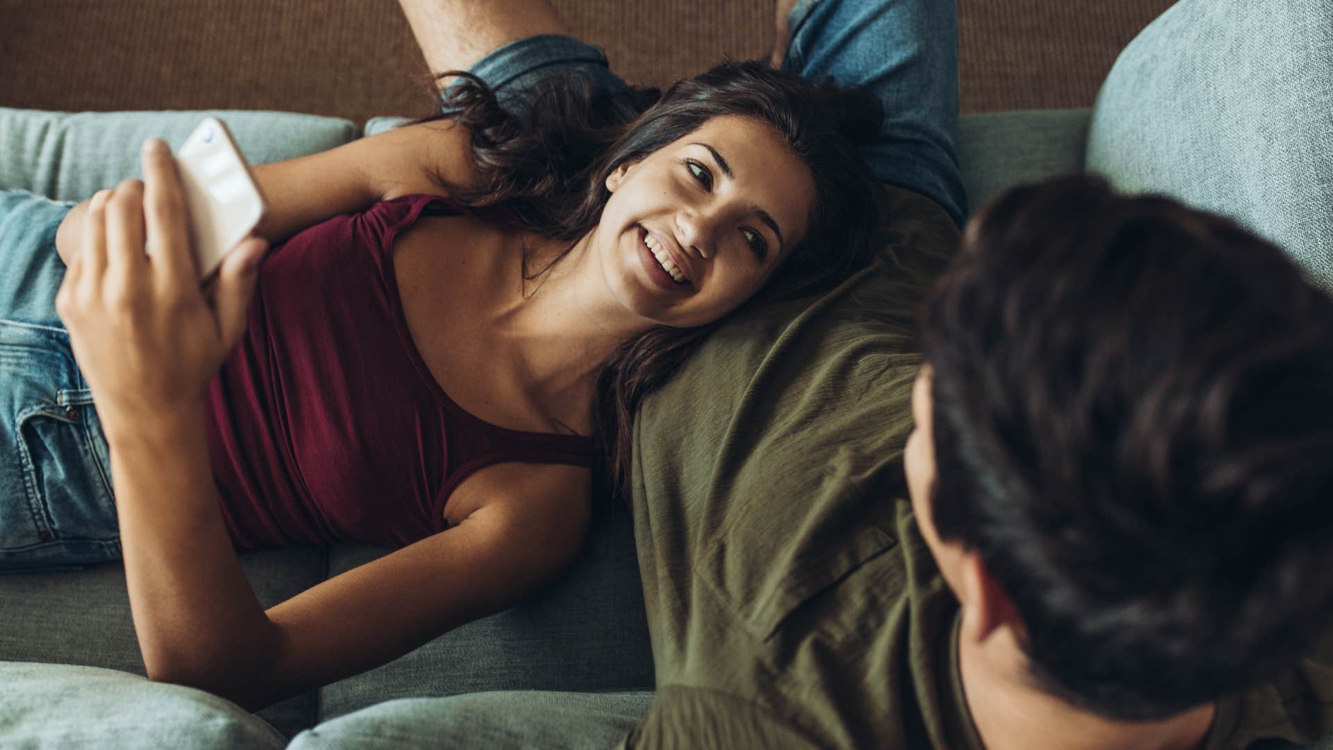 man holding supportive wife in his lap