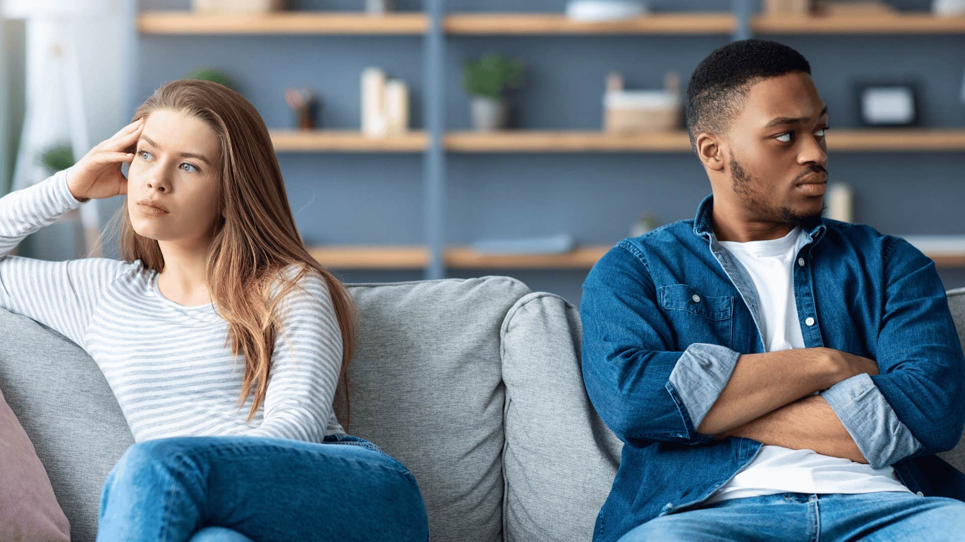 distant couple sitting on the couch