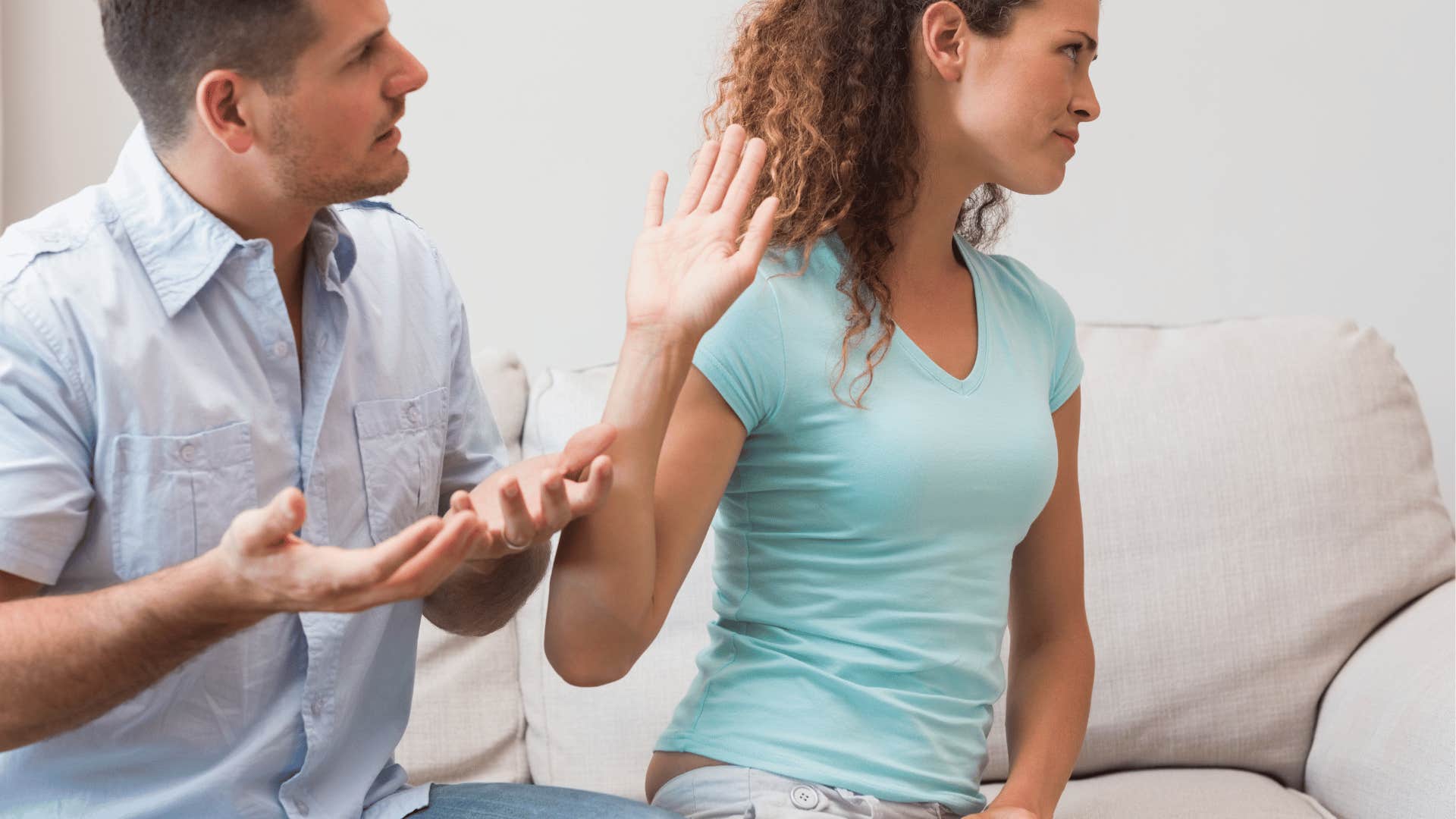 couple arguing on the couch