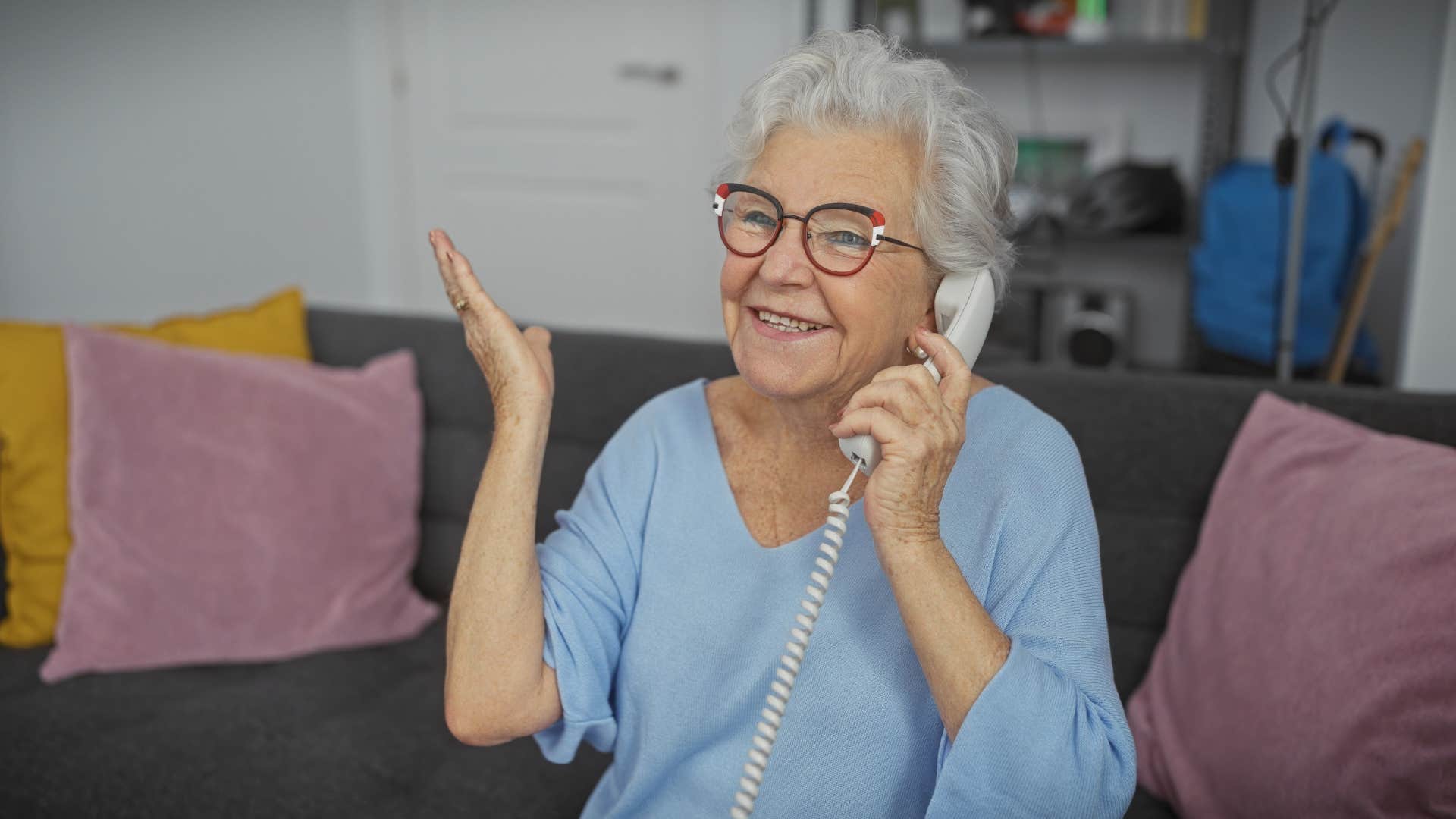 older woman on the phone saying she's staying positive