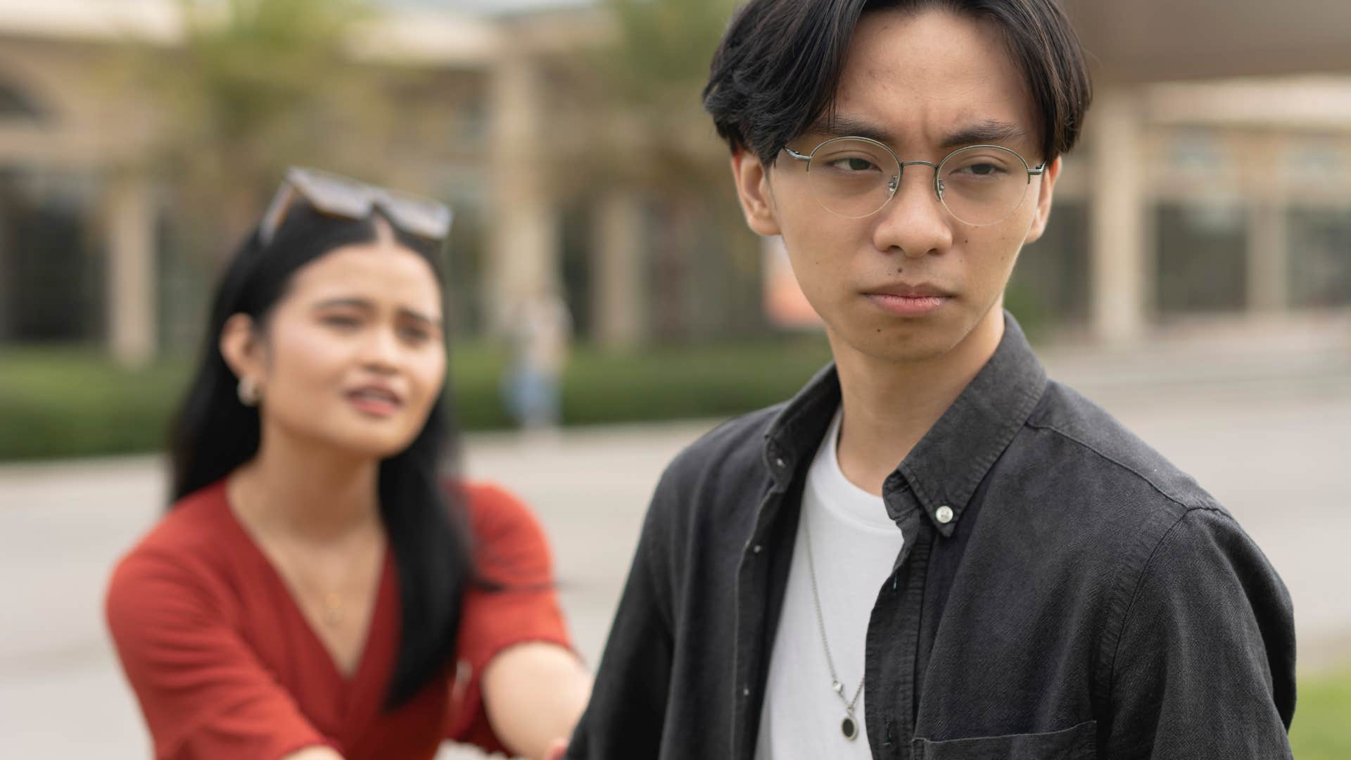 manipulative woman pulling man back