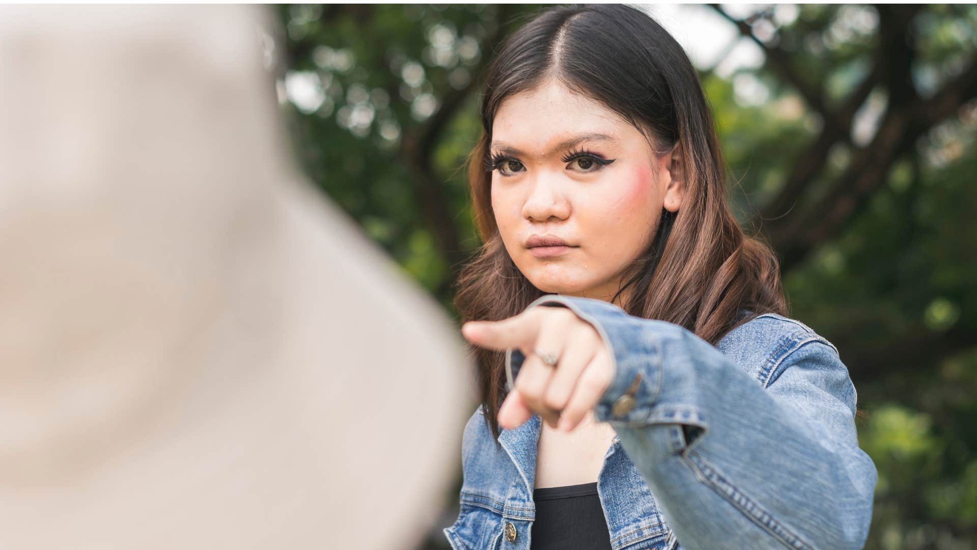 manipulative woman pointing a finger making accusations