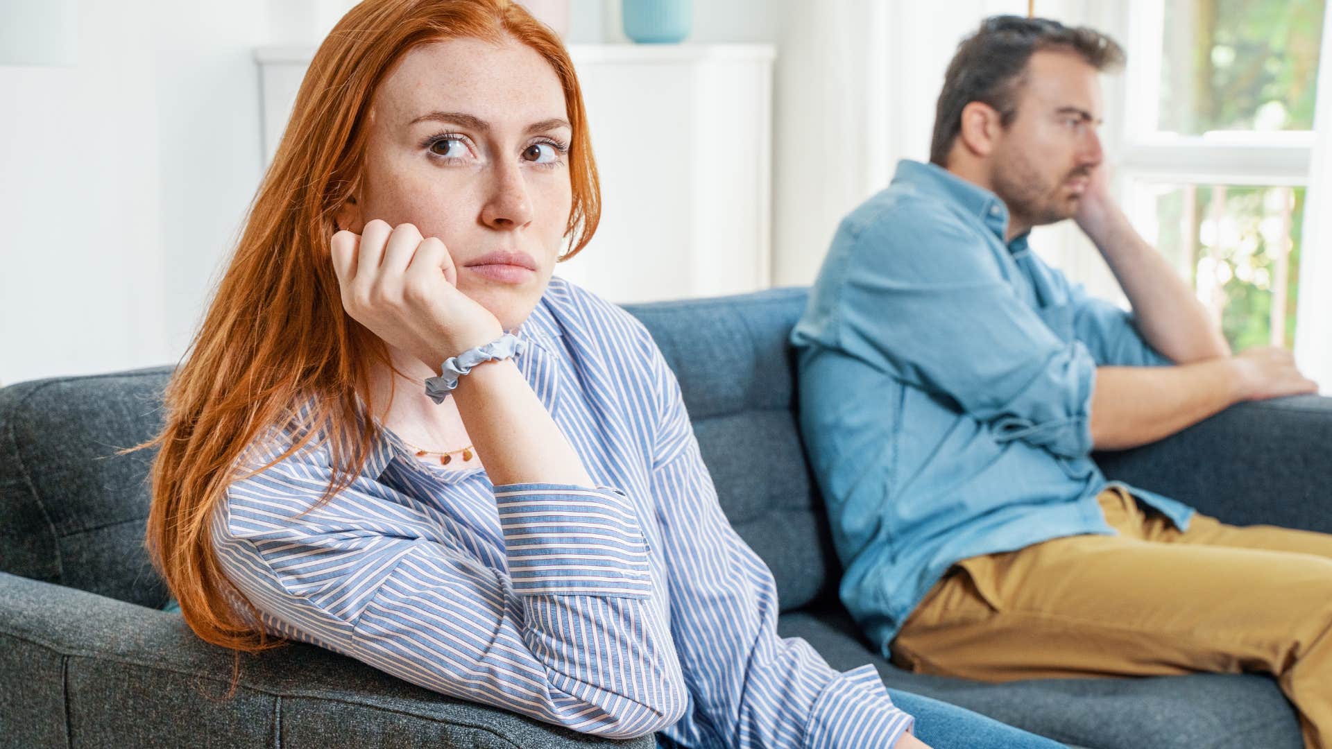 manipulative woman turned away from man being passive-aggressive
