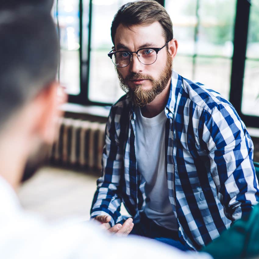 man struggling to accept help talking to a friend