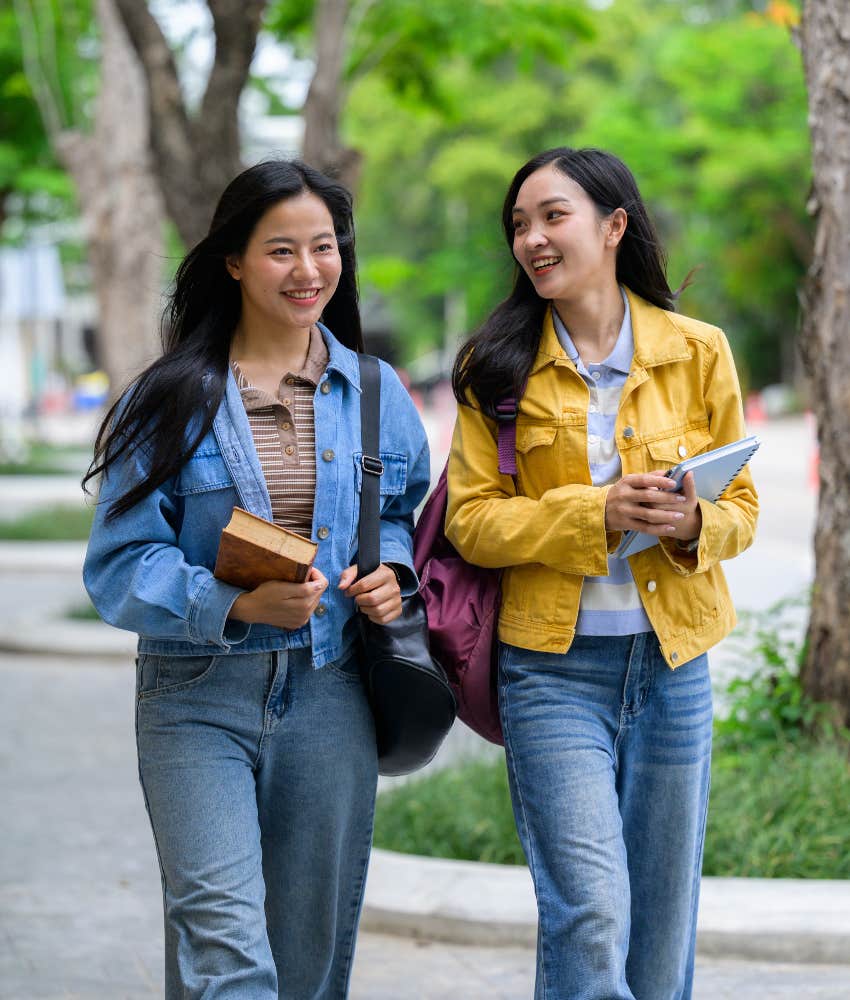 young adult women talking at college