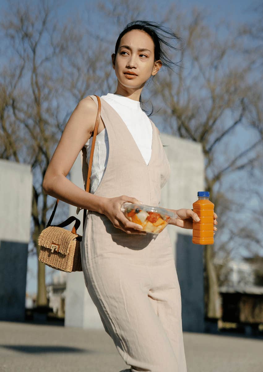 young woman carrying healthy snacks
