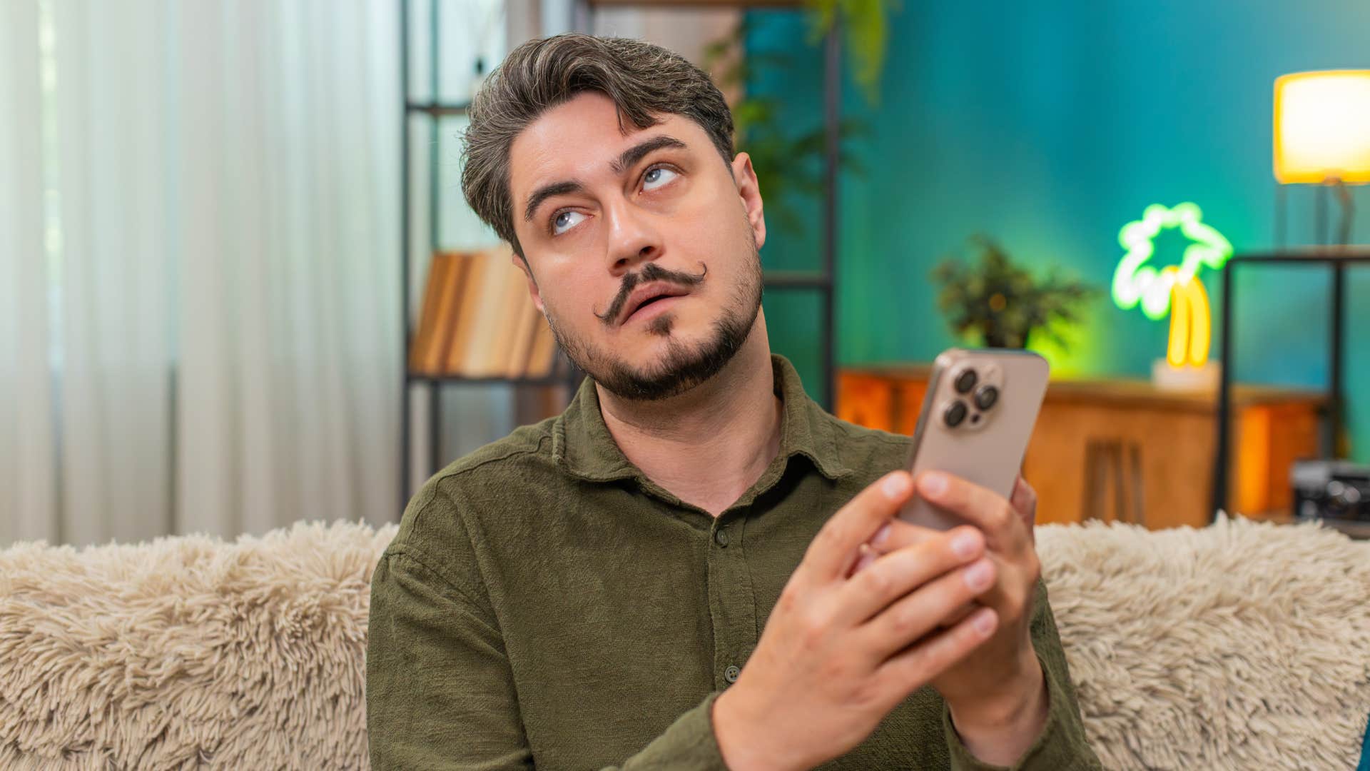 man rolling his eyes texting instead of being a supportive husband