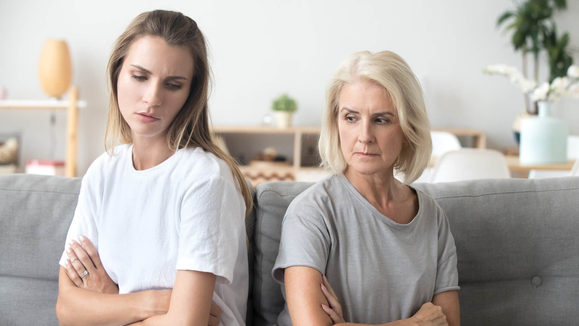 sad mom turned away from adult daughter