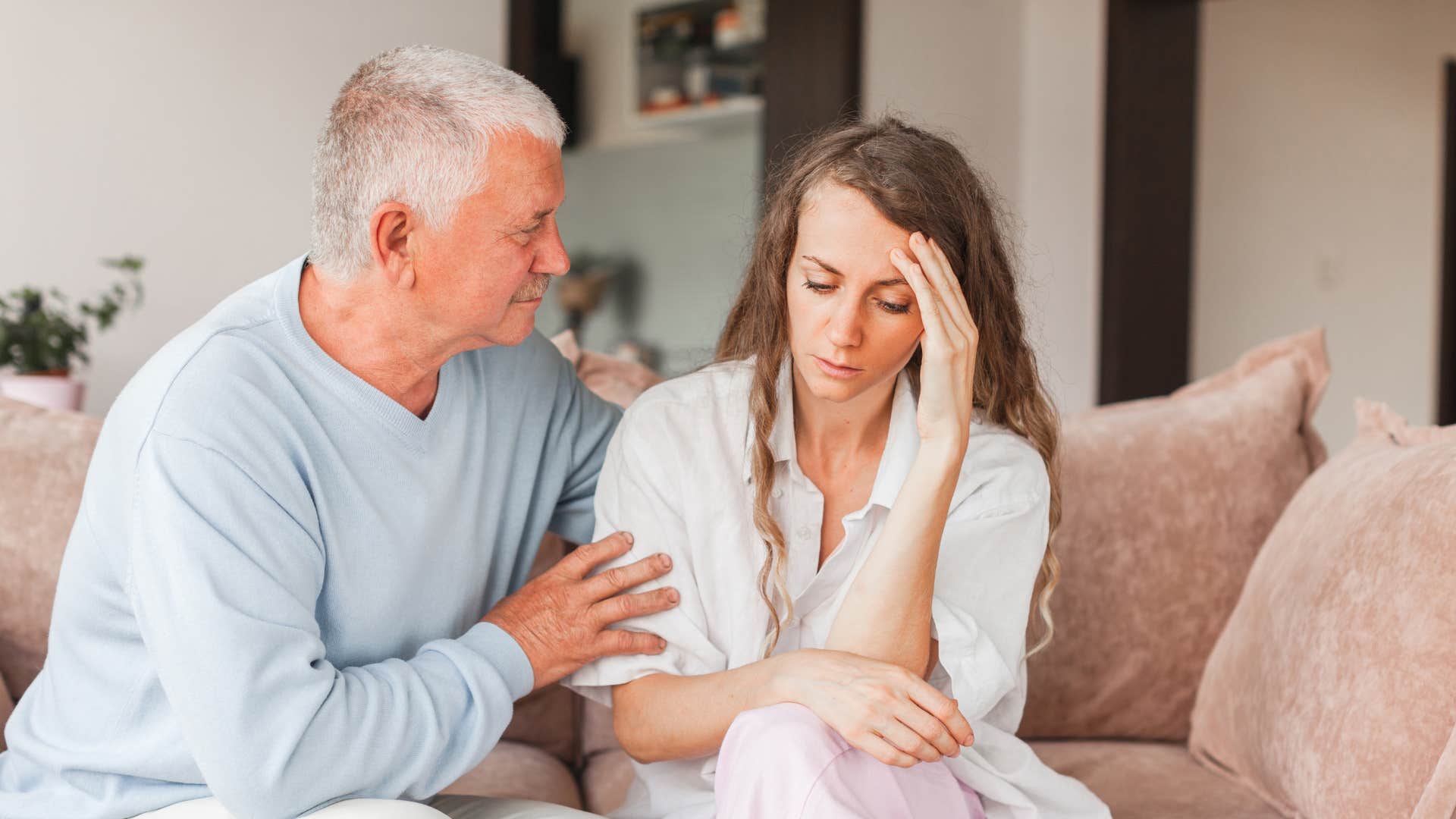 older father comforting daughter saying we miss you