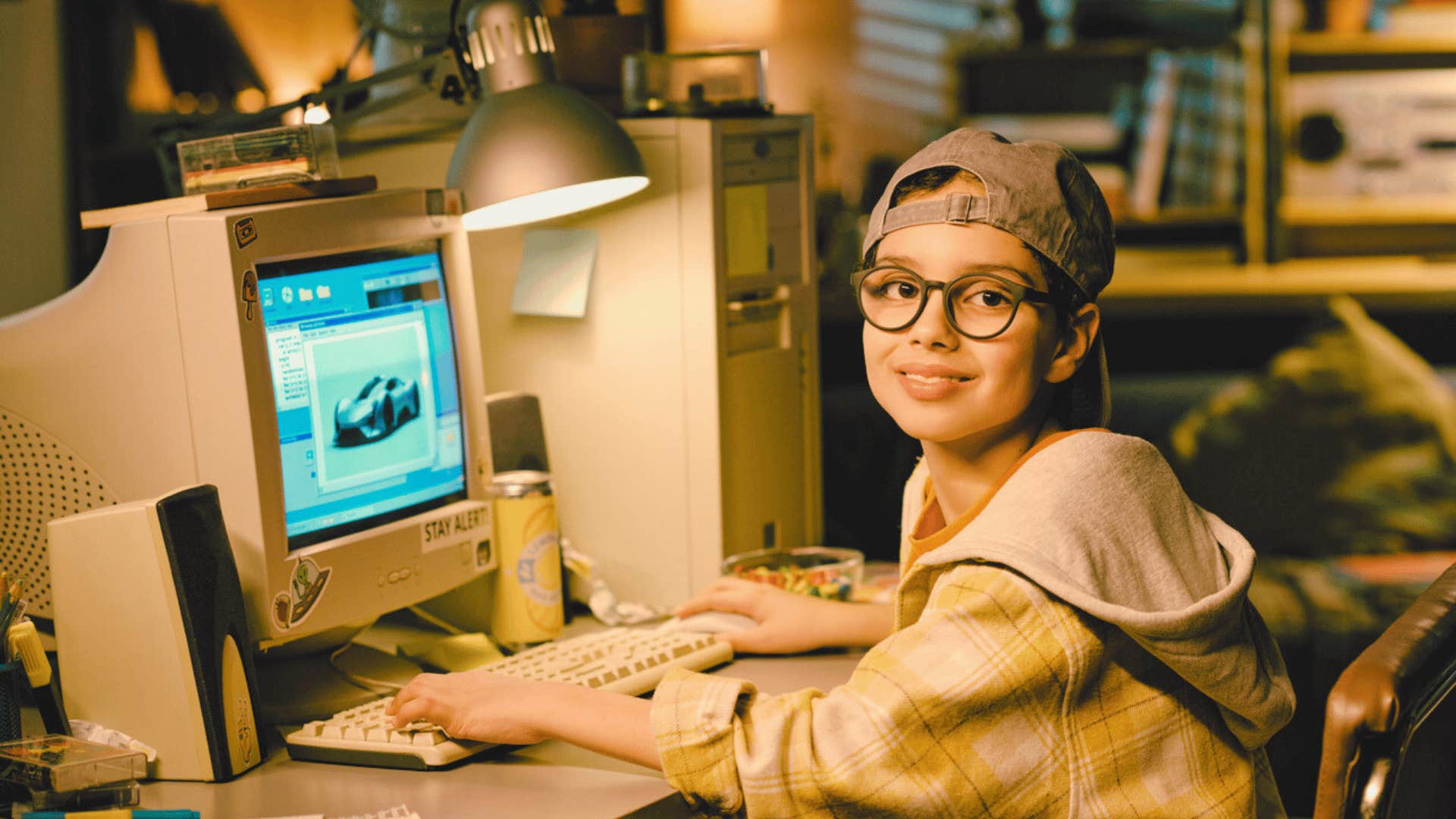 90s kid playing on desktop computer