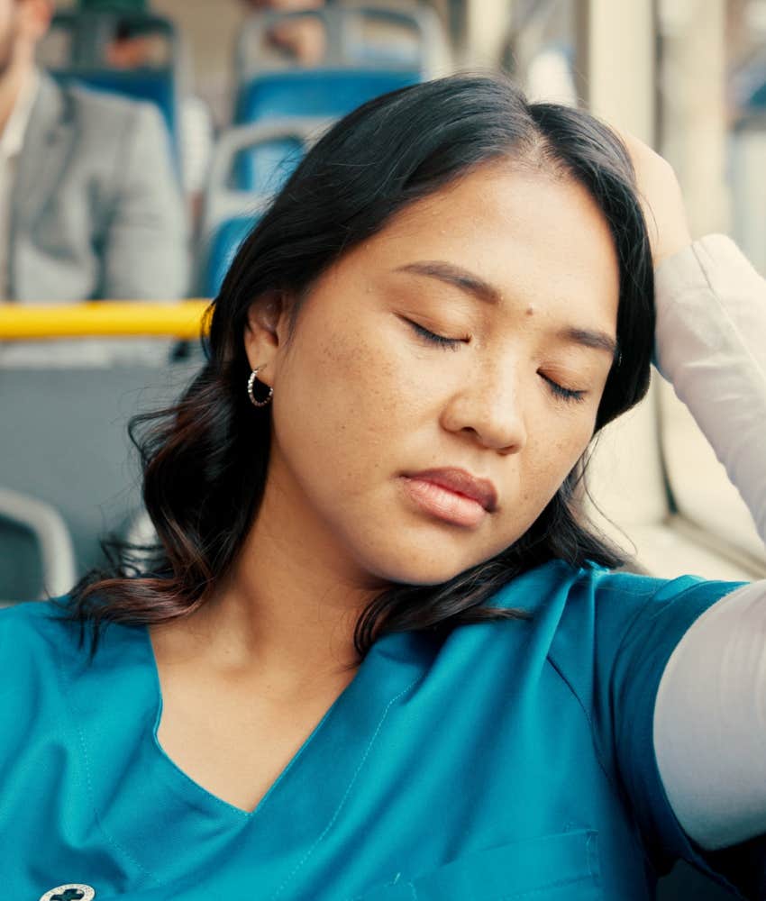 Tired health care professional sleeps on bus showing overtime impacts personal life