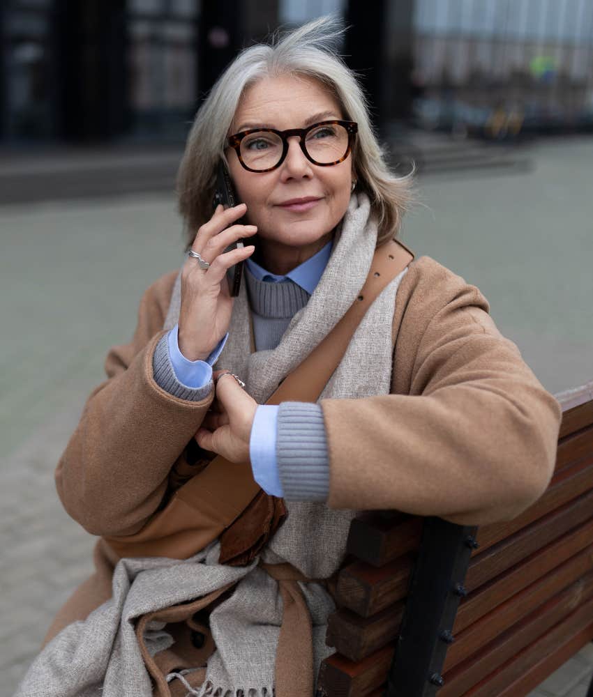 Calm woman contacts person by phone showing struggle with boundaries