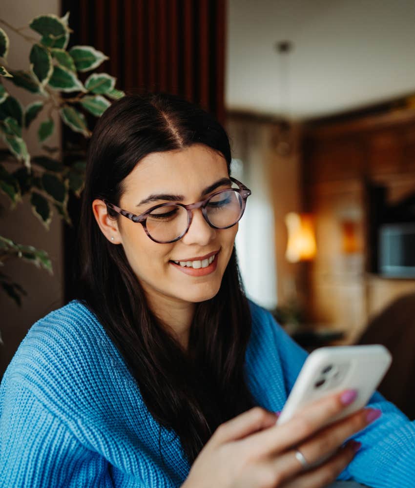 Happy woman answers phone showing struggle with boundaries