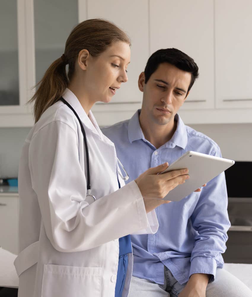 man talking to female doctor
