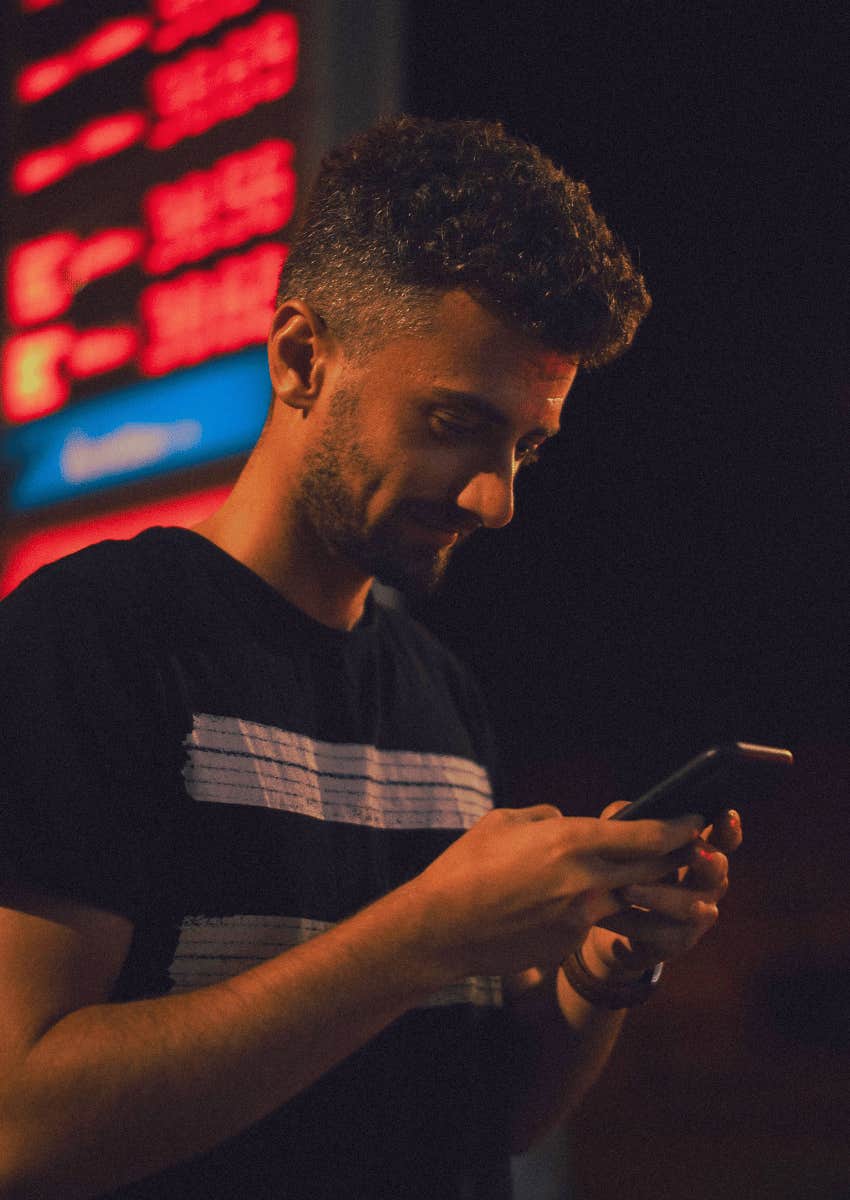 adult man focus on his phone