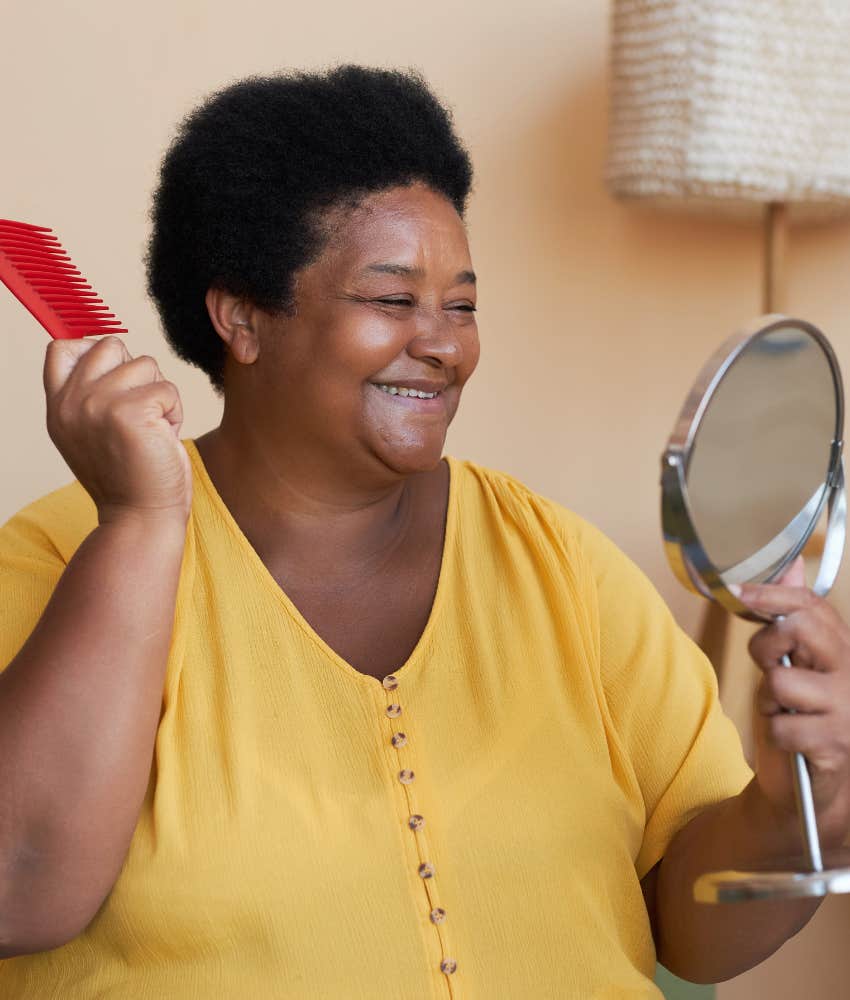 Charming person looks in mirror showing practice is undeniable