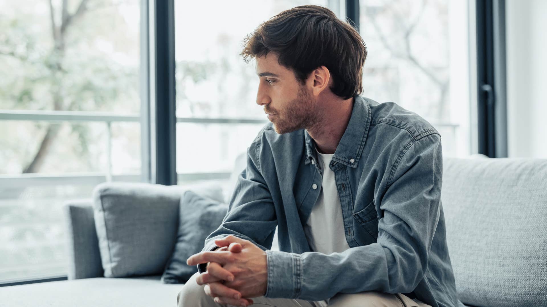 man in jean jacket reflects as he takes more risks