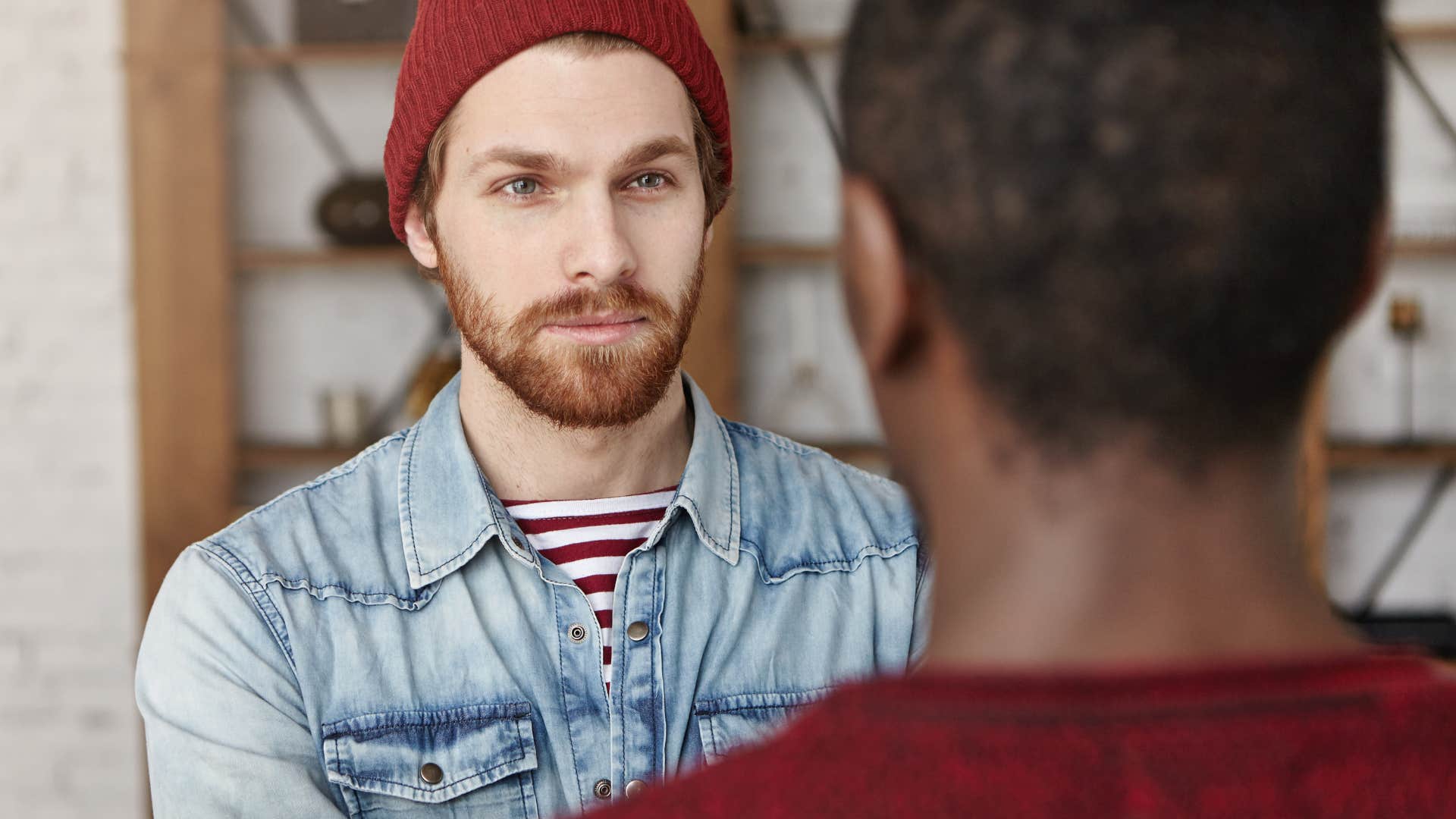 man listening to friend speak