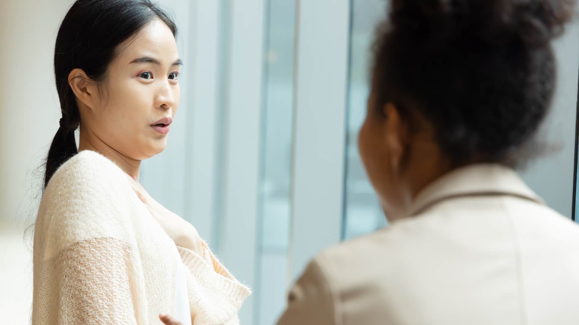 confused and startled woman hesitant to talk to stranger