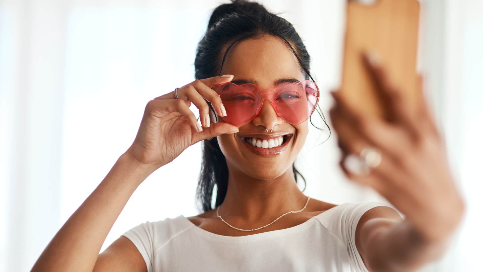 influencer woman posting a lot on social media taking a selfie