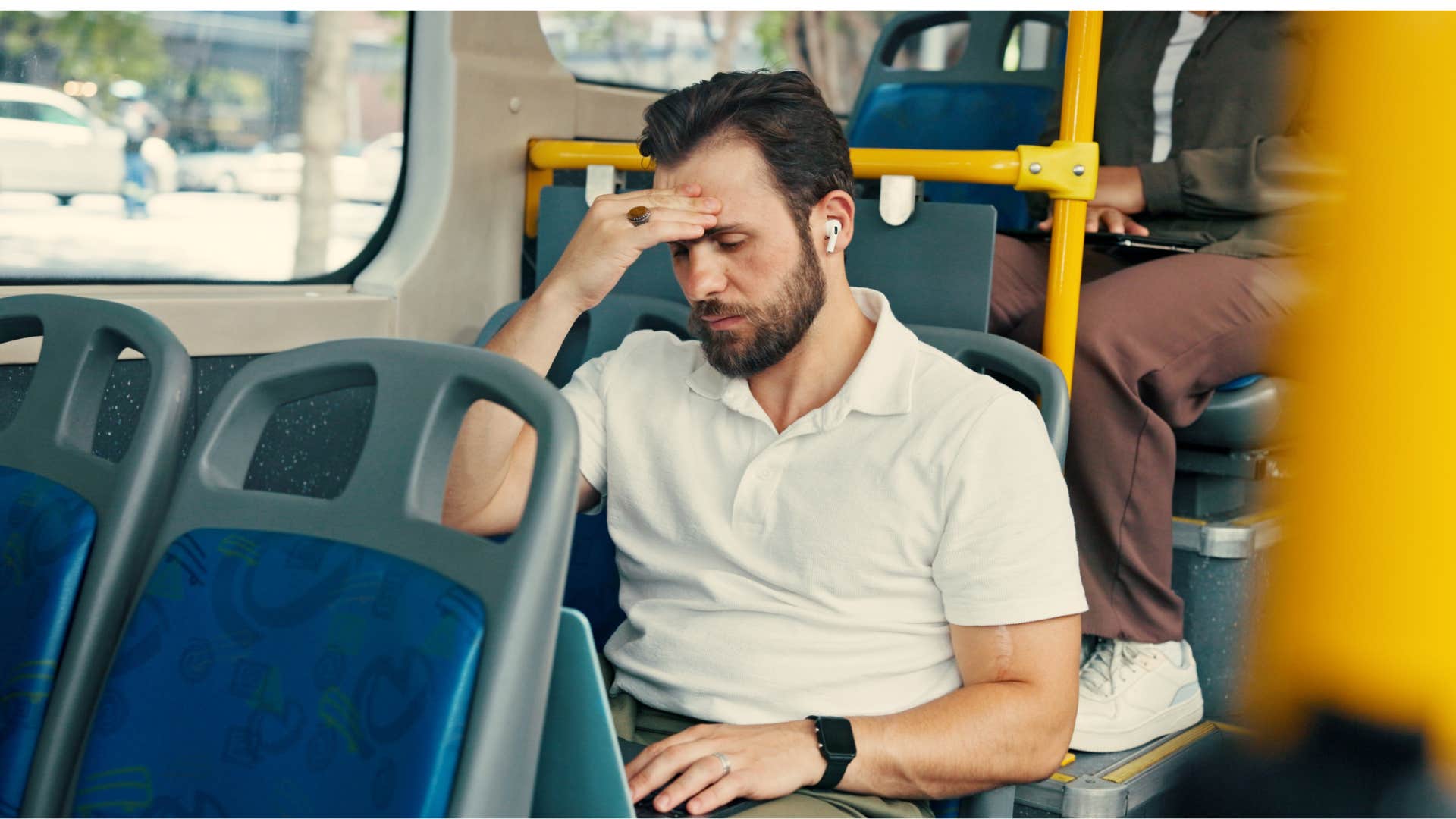 man on bus having a hard time relaxing