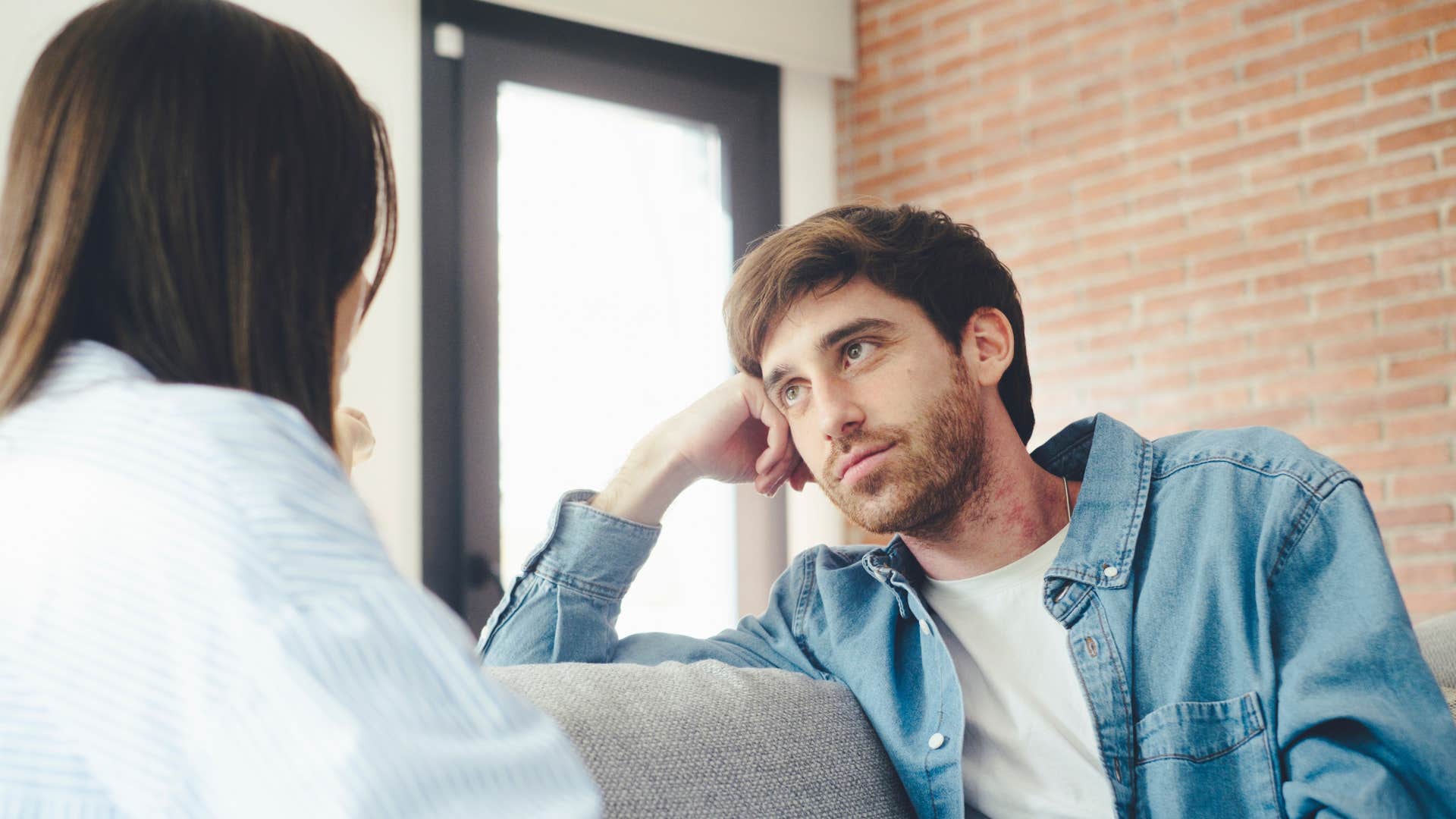 man listening to woman as he seeks approval