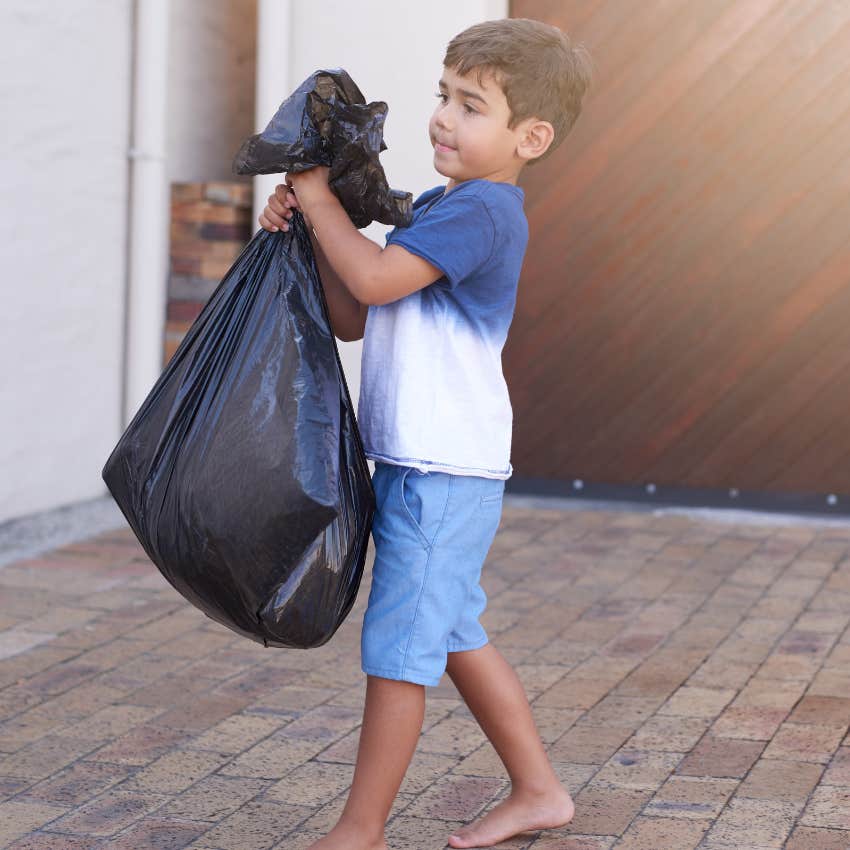 Young boy taking out trash expected to do chores grow up successful