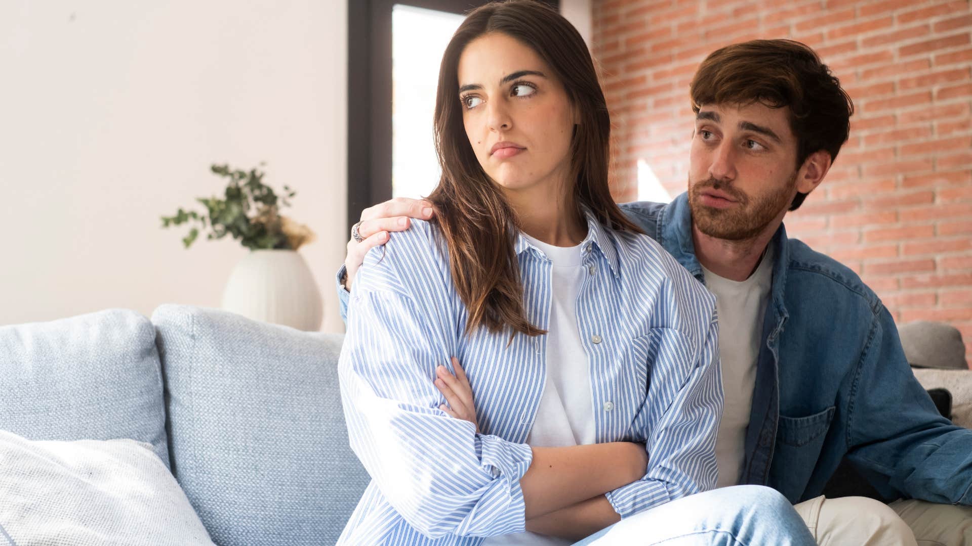 man telling his annoyed wife to just relax