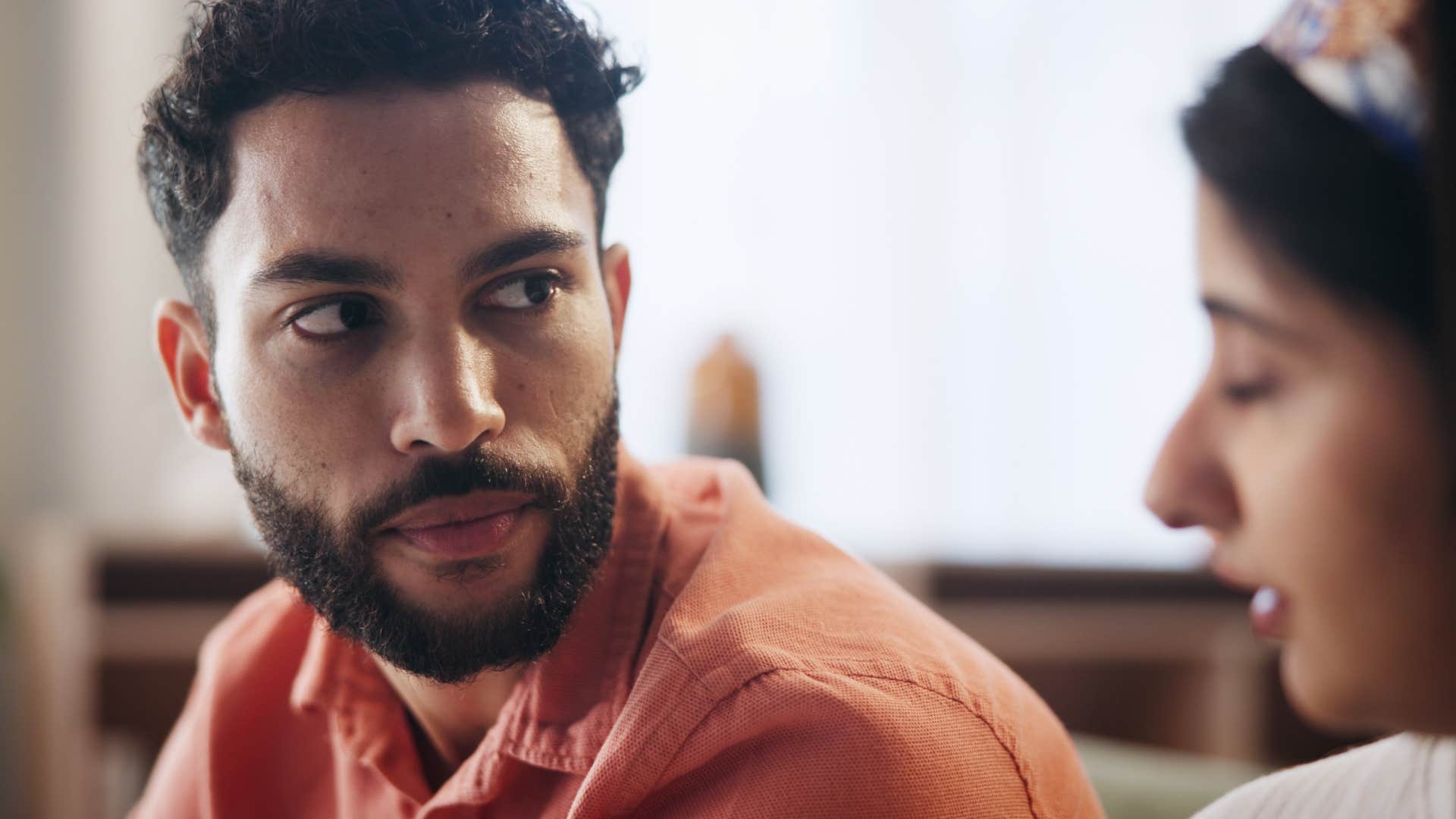 serious husband saying you aren't understanding to his wife