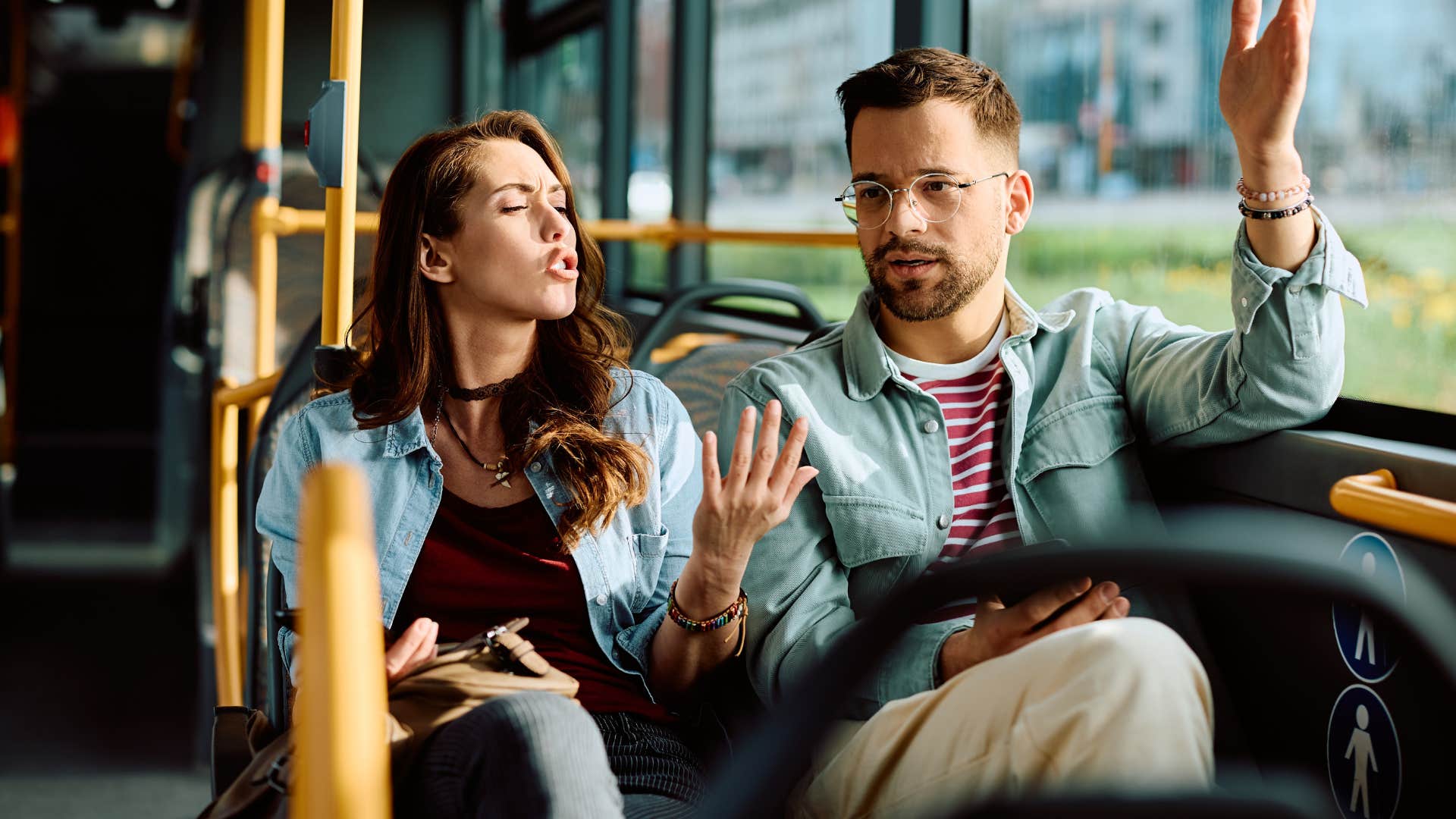 couple arguing on bus wife saying you don't understand to husband