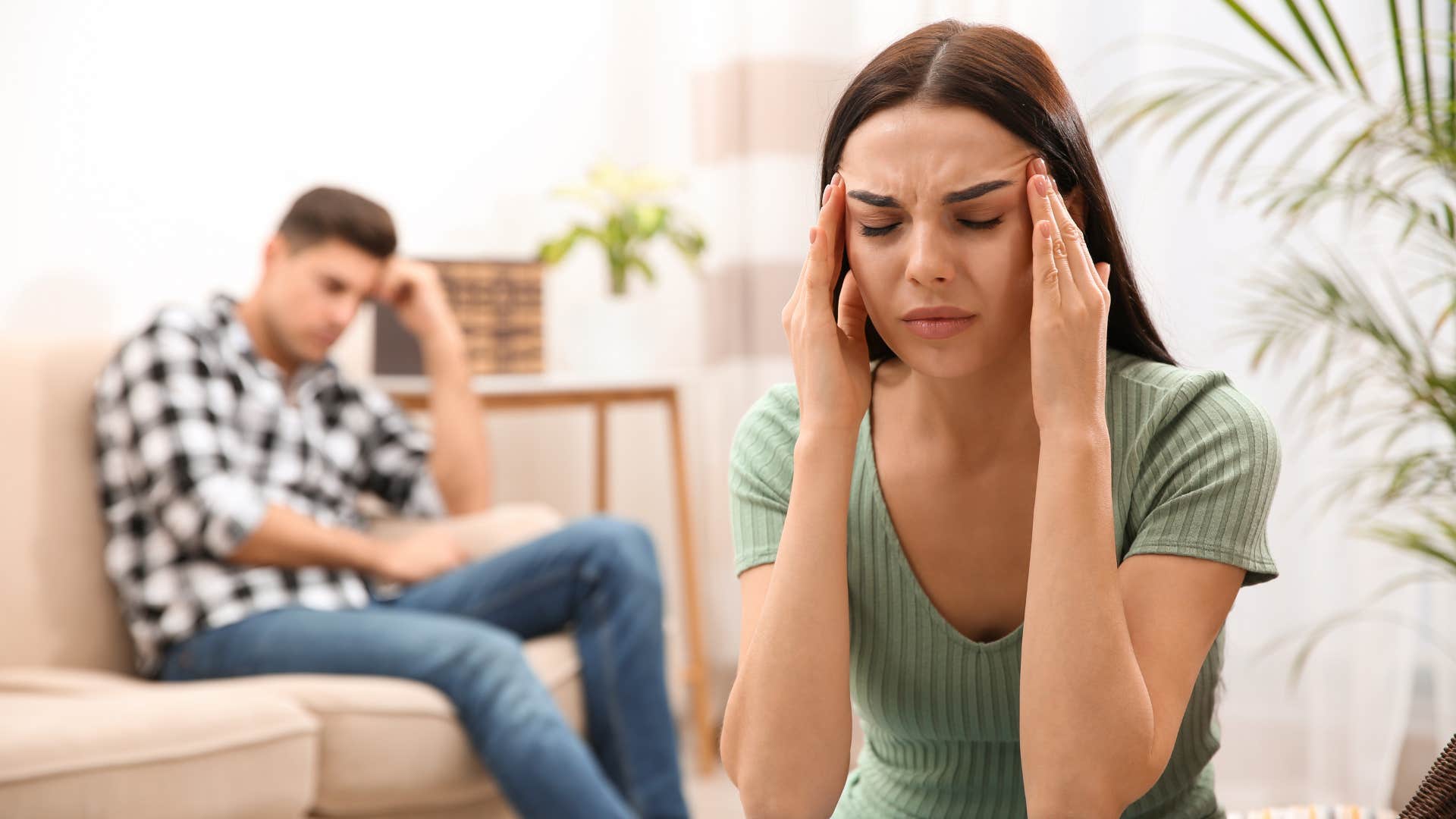 frustrated woman turned away from husband after argument