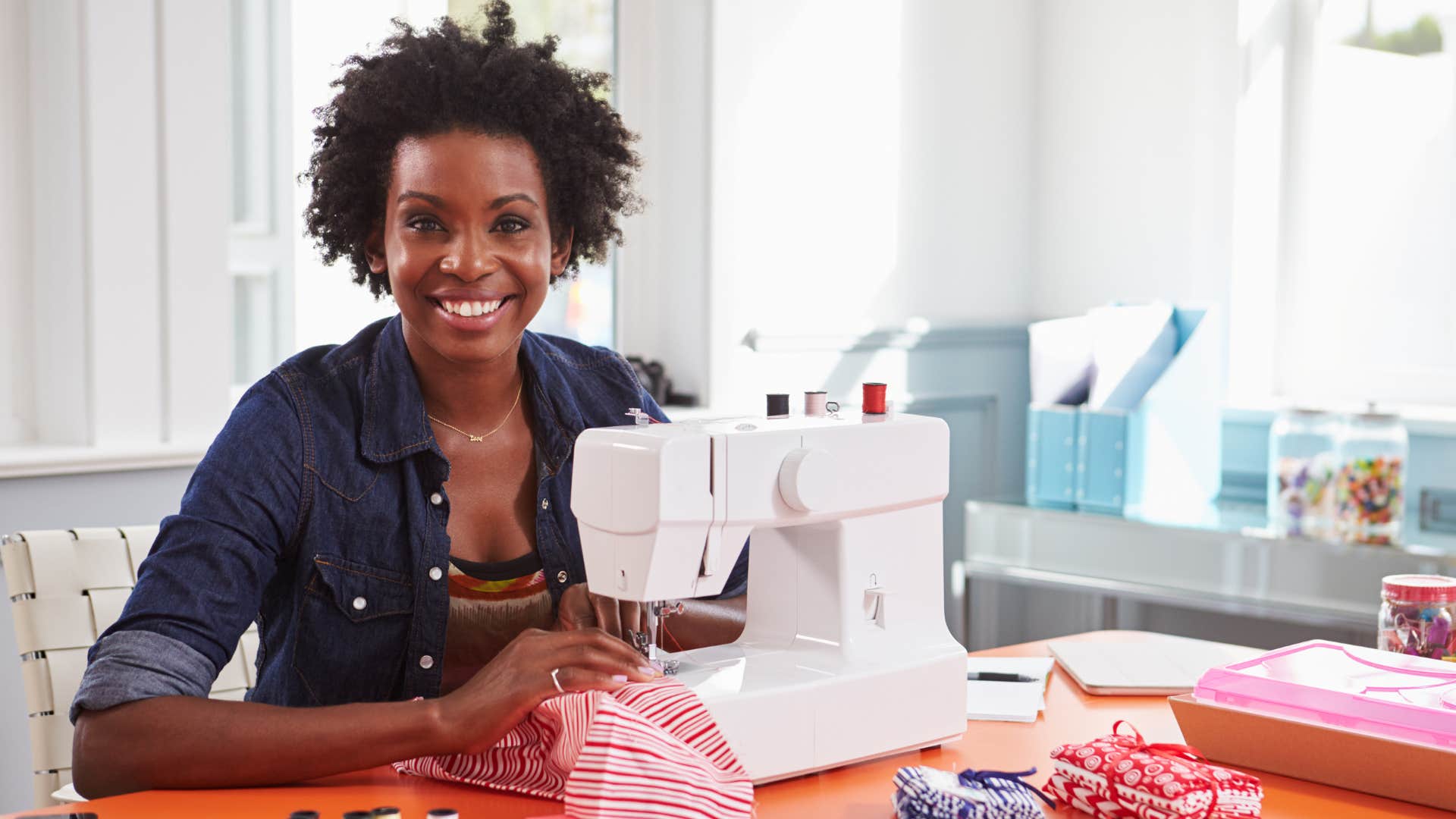 Creative person with sewing machine repurposes top