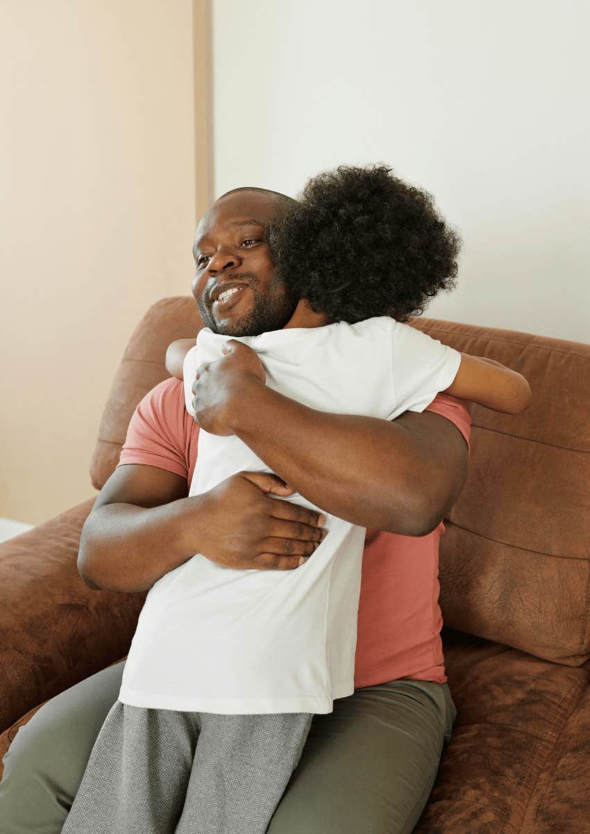 dad hugging young boy close