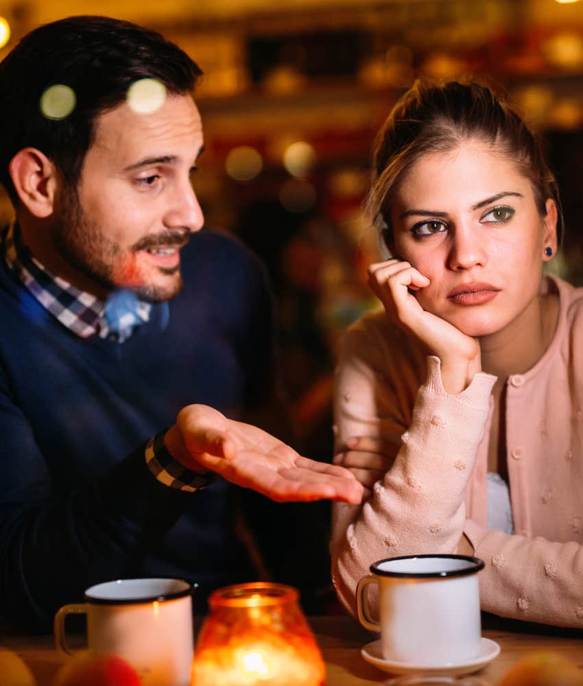 Upset woman is mocked by man showing dating mistake