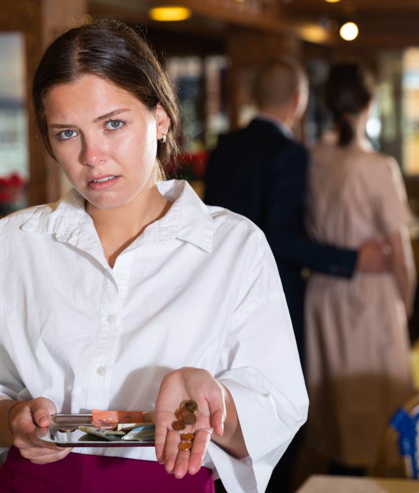 Shocked waiter with a handful of pennies showing not tipping is dating mistake