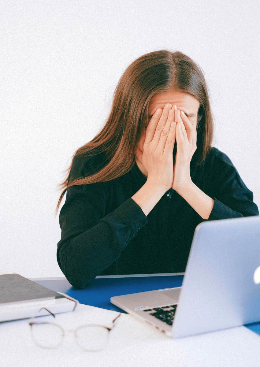 desperate woman covering her face