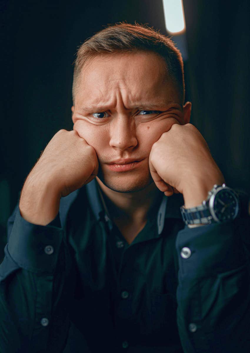 disgruntled young man staring