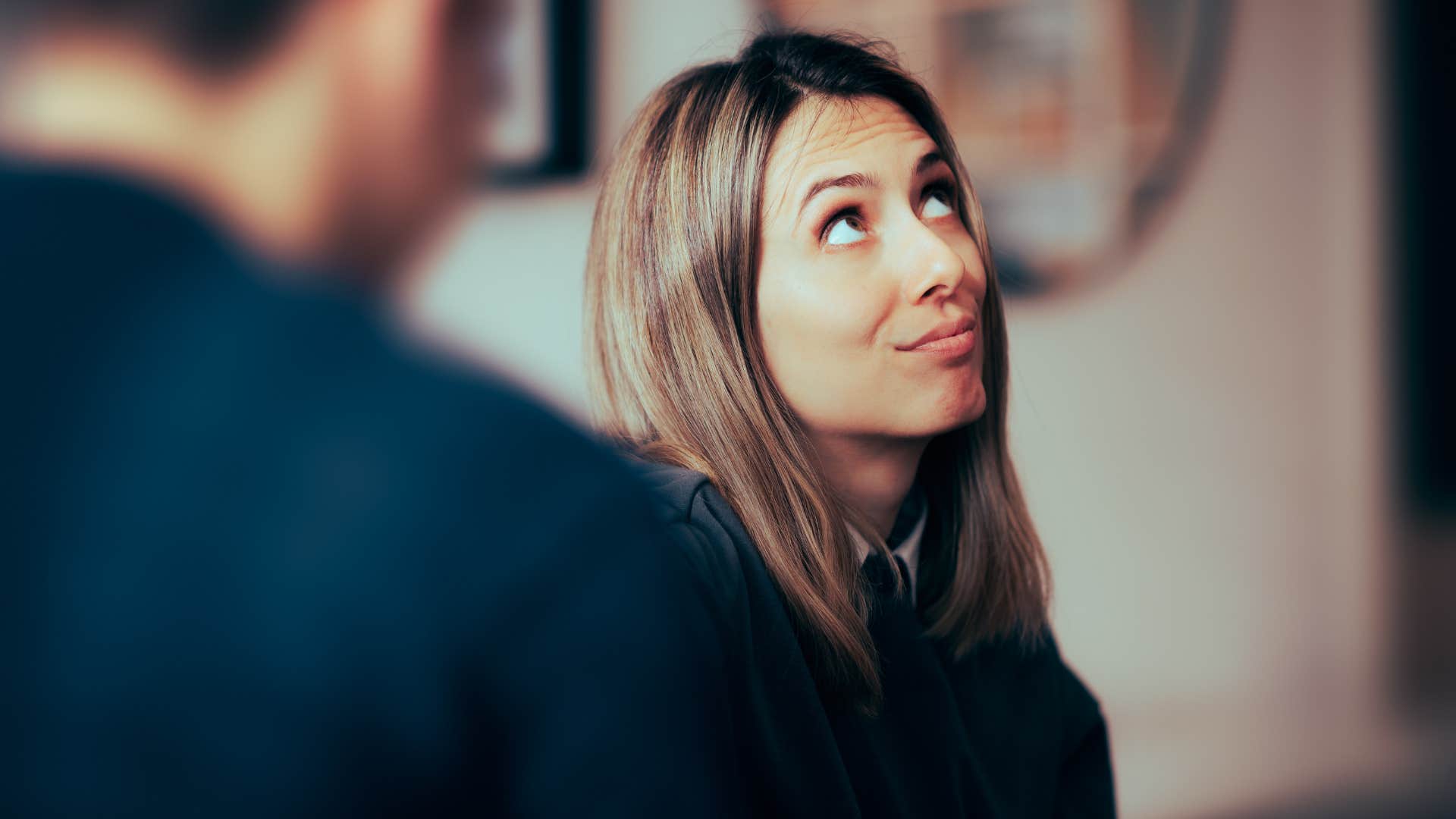 annoyed woman trying to avoid small talk