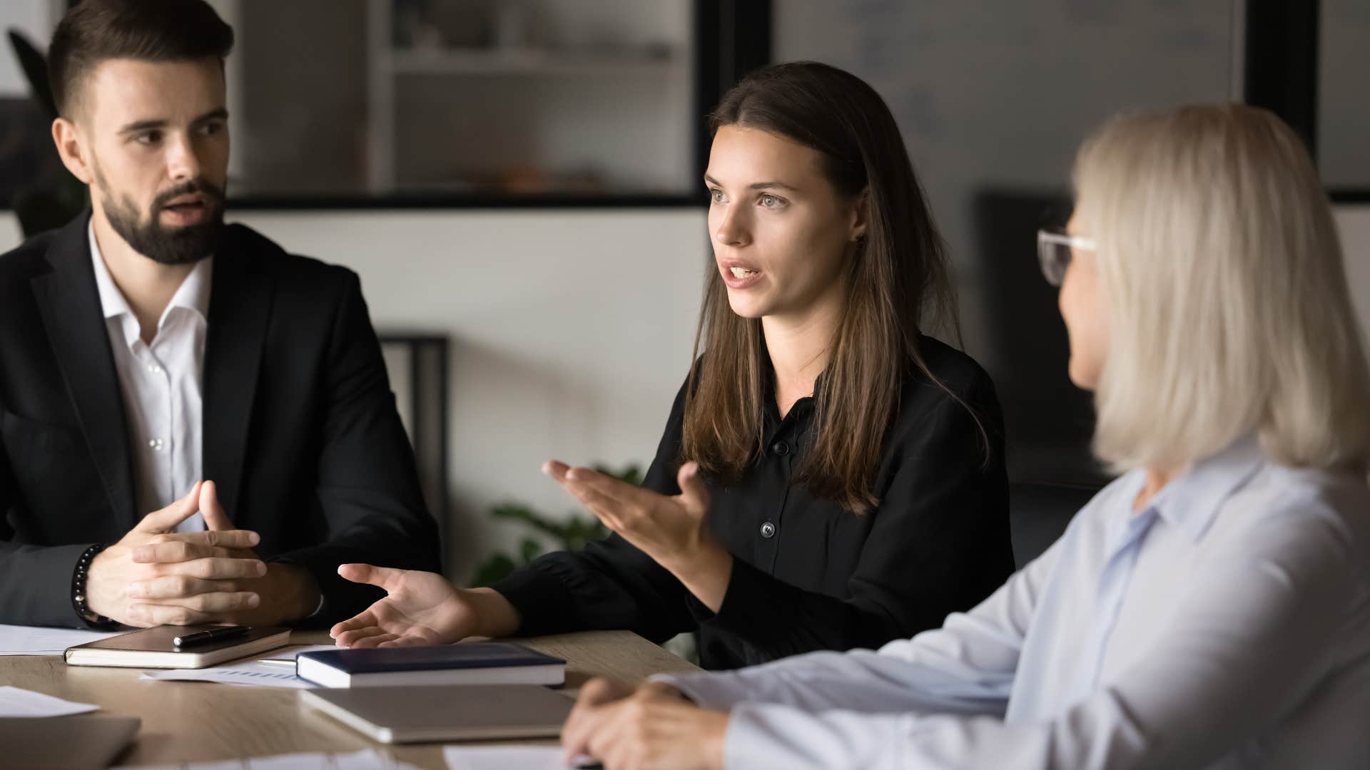 woman giving vague instructions to team at work